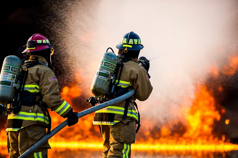 Firefighters battling flames — fire damage restoration billing Florida