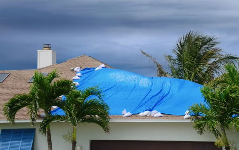 Florida home with blue tarp after hurricane roof damage - roofing contractor billing supplement recovery